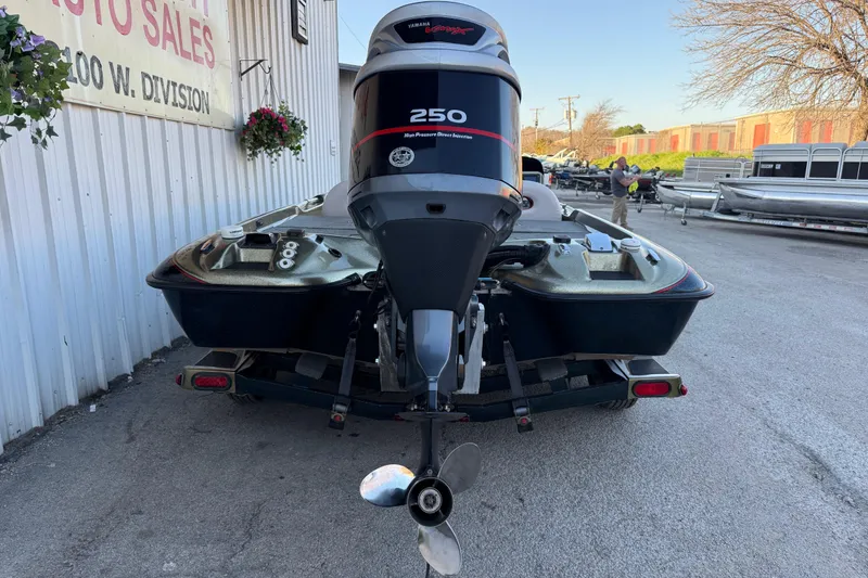 Slide: The Image of 2005 Bass Cat Puma boat with Yamaha 250 engine at dealership. - 14