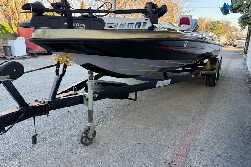 Slide: The Image of 2005 Bass Cat Puma boat on trailer with Minn Kota Fortrex motor. - 19