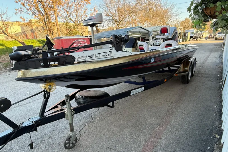 Slide: The Image of 2005 Bass Cat Puma boat on trailer, featuring Minn Kota Fortrex motor. - 20