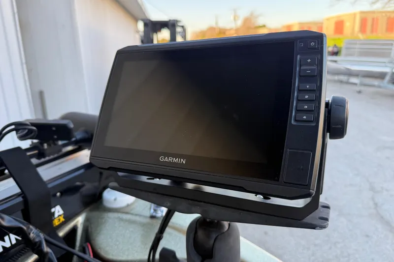 Slide: The Image of Garmin device mounted on a 2005 Bass Cat Puma boat, outdoor setting. - 24