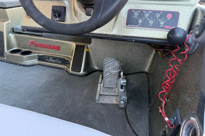Slide: The Image of 2005 Bass Cat Puma boat interior with control panel and foot pedal. - 30