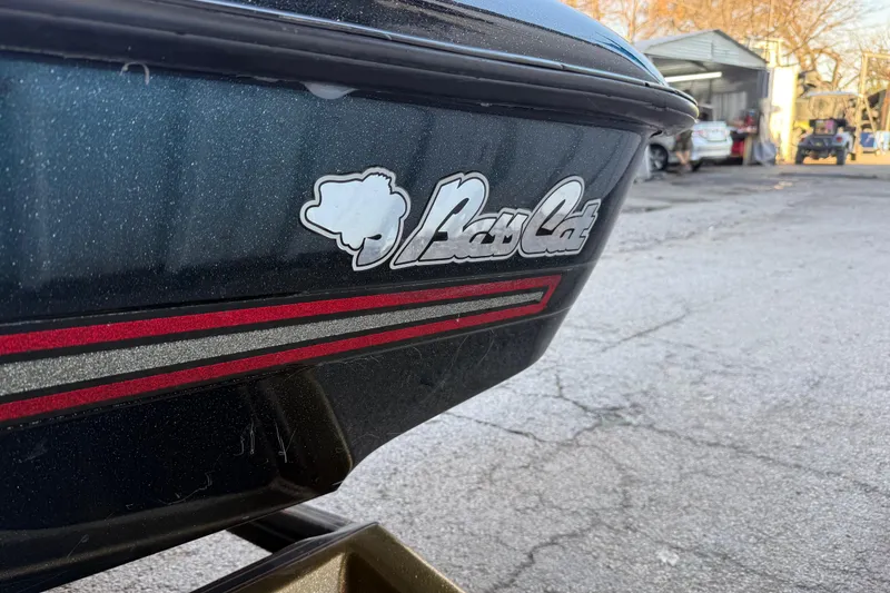 Slide: The Image of 2005 Bass Cat Puma boat with logo and red stripe detailing. - 34