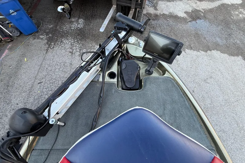 Slide: The Image of 2005 Bass Cat Puma boat deck with fishfinder and trolling motor. - 51