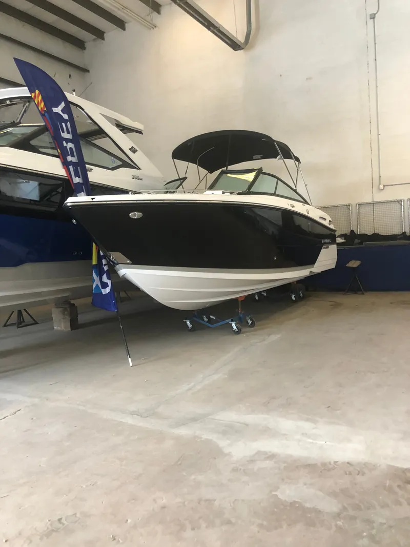 Slide: The Image of 2019 Monterey 258SS Super Sport boat in a showroom. - 13