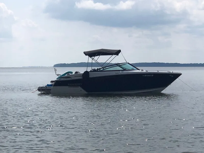 Slide: The Image of 2019 Monterey 258SS Super Sport boat on calm water. - 4