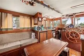 Slide: The Image of Interior of 1984 Grand Banks 36 Classic yacht with wooden furnishings and helm. - 3