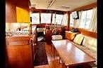 Slide: The Image of Interior of 1984 Grand Banks 36 Classic yacht with wood finish and seating area. - 4