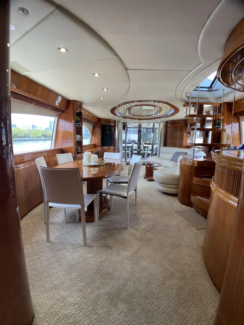 Slide: The Image of Luxurious interior of 1999 Azimut 85 Ultimate yacht with elegant wood finishes and modern furnishings. - 12