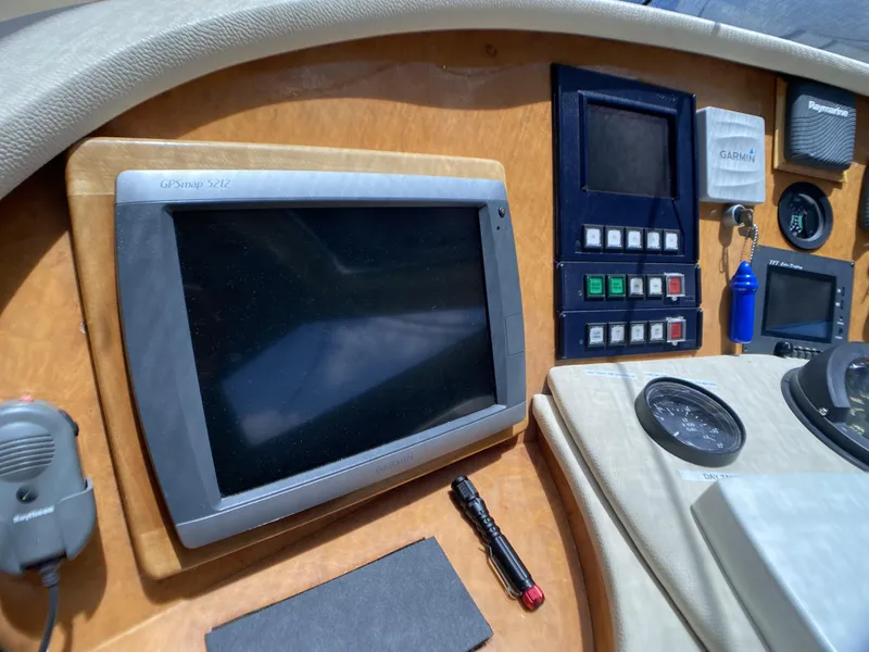 Slide: The Image of Cockpit of 1999 Azimut 85 Ultimate yacht with navigation instruments and steering wheel. - 29