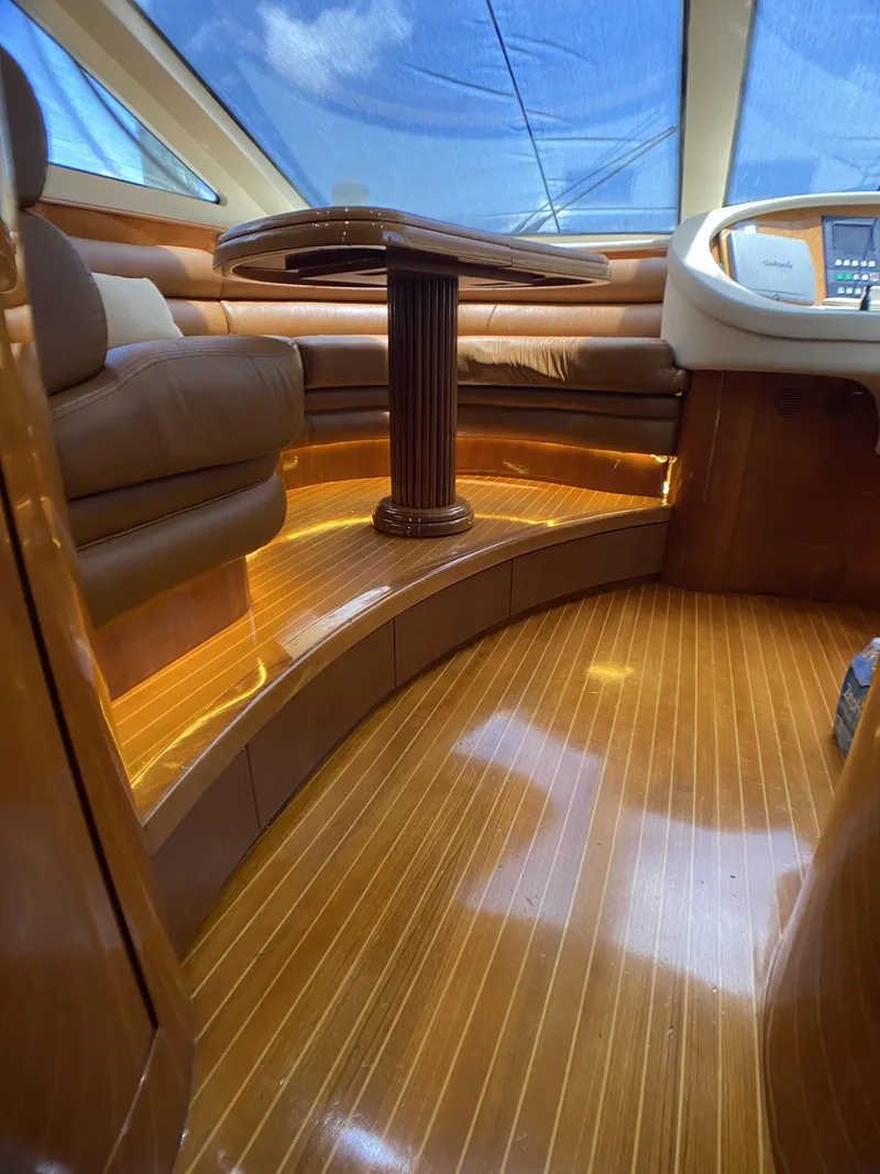 Slide: The Image of Luxurious interior of a 1999 Azimut 85 Ultimate yacht with elegant wood finishes. - 36