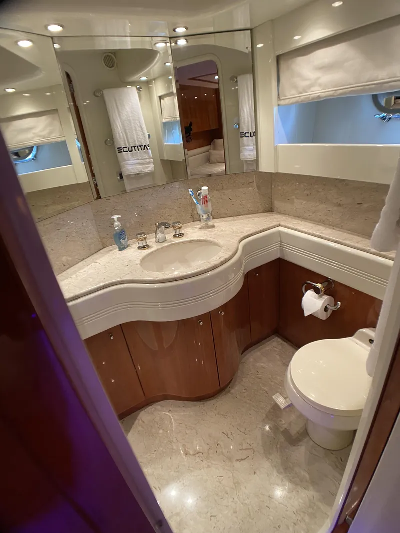 Slide: The Image of Luxurious interior of 1999 Azimut 85 Ultimate yacht with elegant wooden staircase and plush seating. - 39