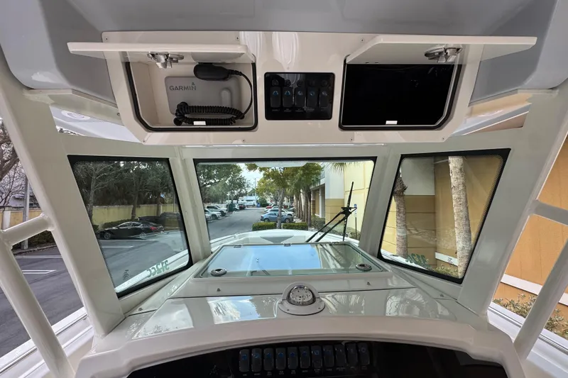 Slide: The Image of Interior view of 2026 Sailfish 312 CC boat cockpit with Garmin equipment. - 12
