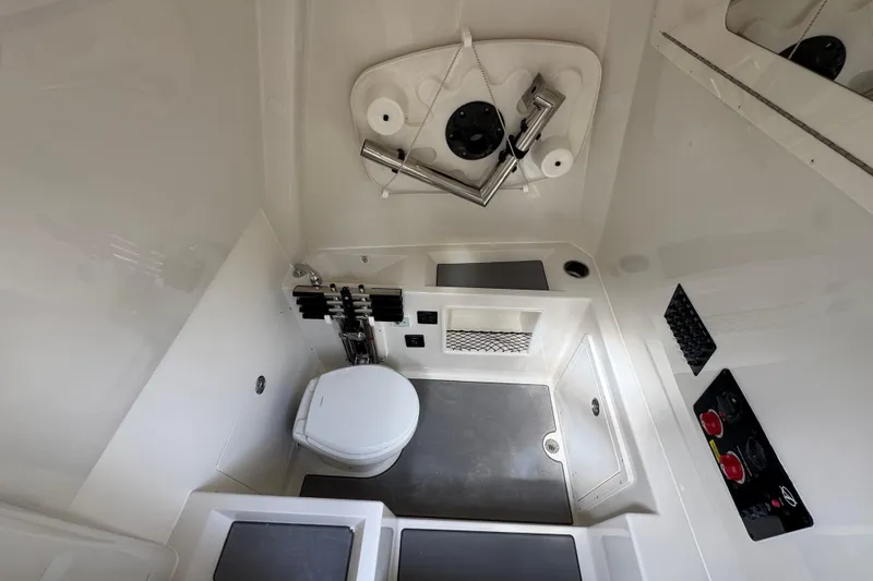 Slide: The Image of 2026 Sailfish 312 CC boat interior with modern bathroom amenities and sleek design. - 14