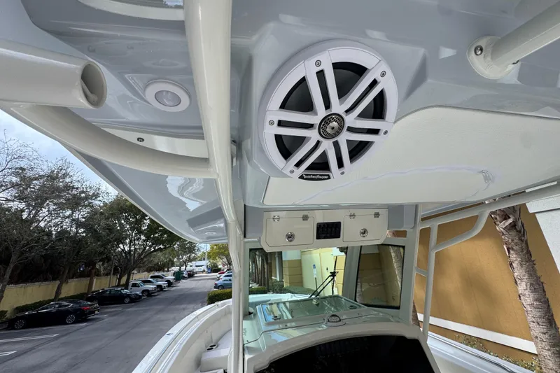 Slide: The Image of 2026 Sailfish 312 CC boat interior with speaker and storage compartments. - 28