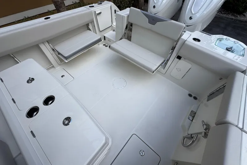 Slide: The Image of 2026 Sailfish 312 CC boat interior with seating and storage compartments. - 6