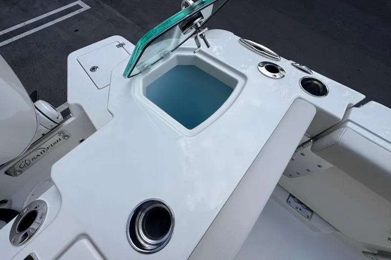 Slide: The Image of 2026 Sailfish 312 CC boat interior with seating and storage compartments. - 7