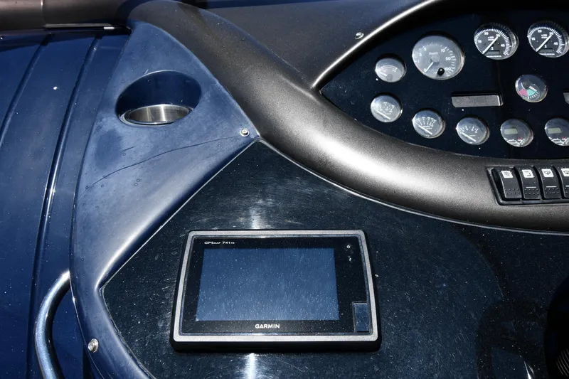 Slide: The Image of Dashboard of a 2000 Sunseeker Superhawk 34 with Garmin navigation system. - 13
