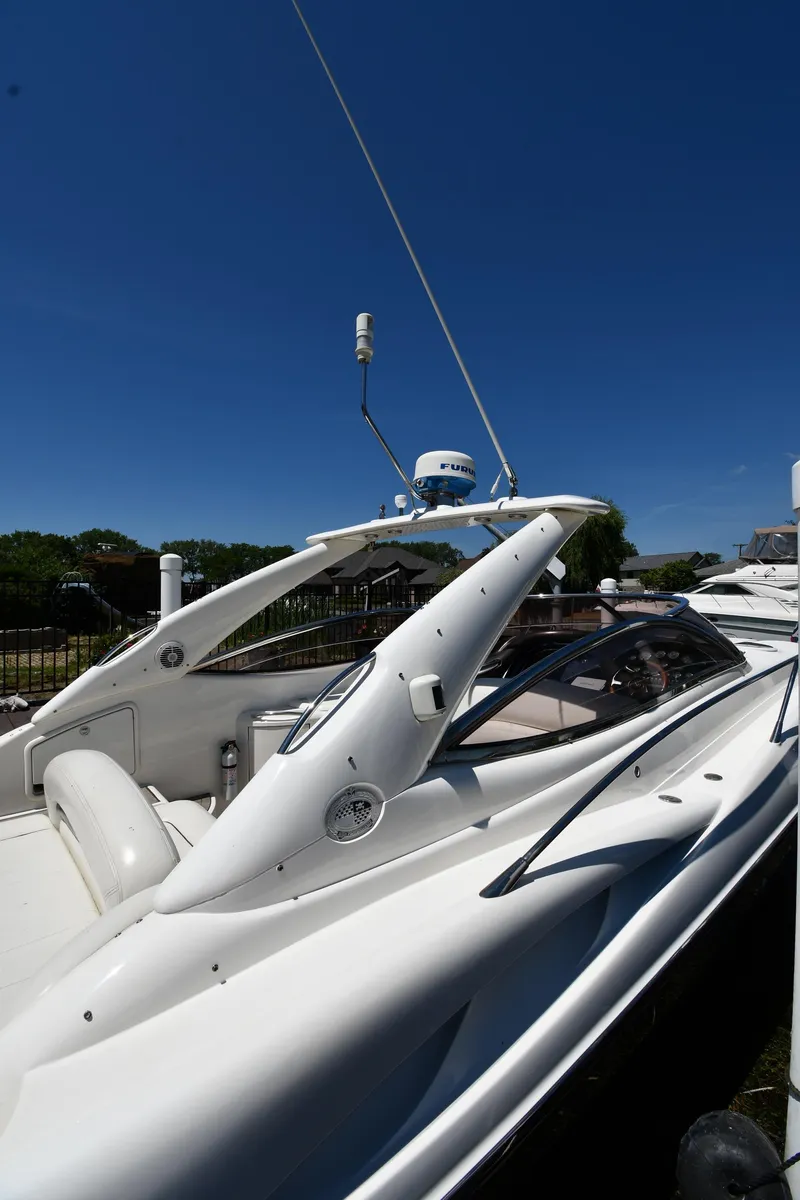 Slide: The Image of 2000 Sunseeker Superhawk 34 yacht docked in harbor. - 2