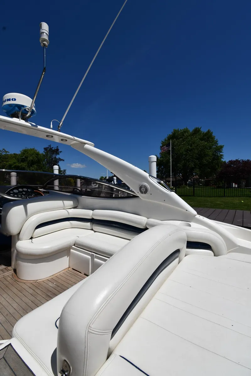 Slide: The Image of Sunseeker Superhawk 34, 2000 model, featuring luxurious white seating area. - 20