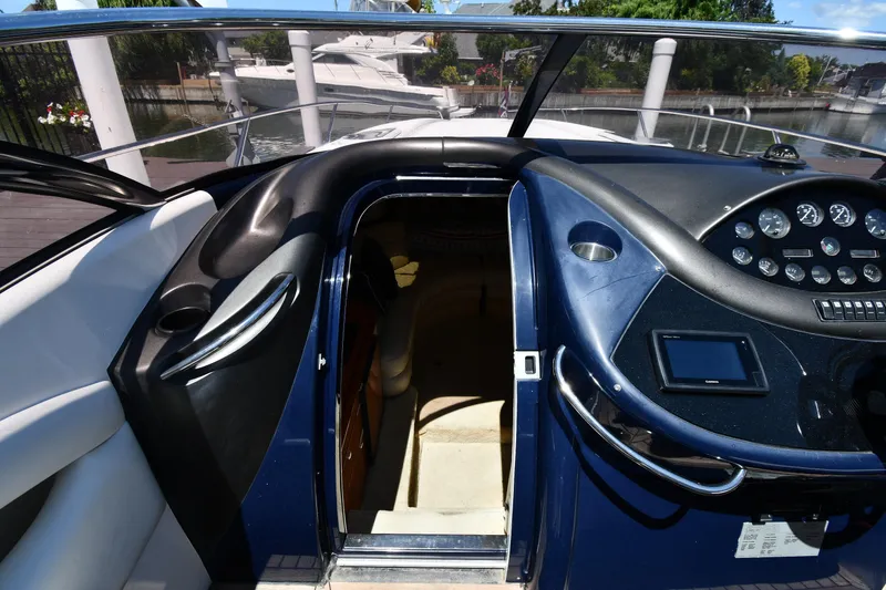 Slide: The Image of Cockpit of 2000 Sunseeker Superhawk 34 with control console. - 28