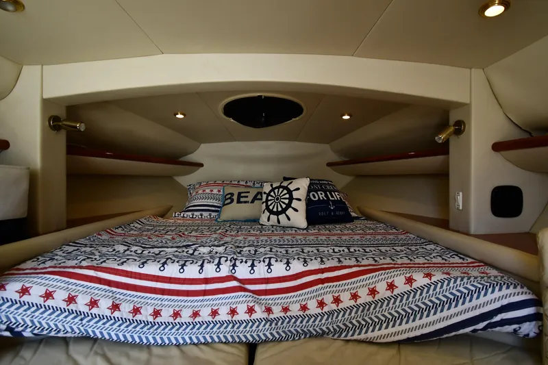 Slide: The Image of Interior of 2000 Sunseeker Superhawk 34 yacht with cozy bed. - 29