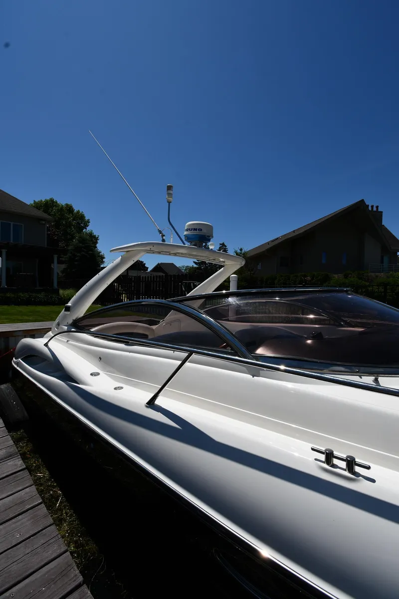Slide: The Image of 2000 Sunseeker Superhawk 34 at dock, sunny day. - 3