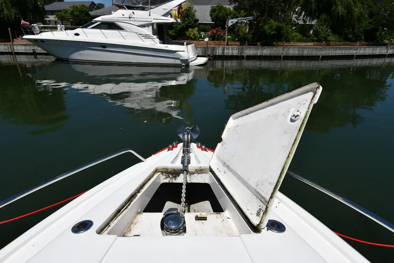 Slide: The Image of 2000 Sunseeker Superhawk 34 at dock, sunny day. - 4