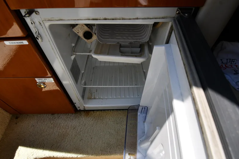 Slide: The Image of 2000 Sunseeker Superhawk 34 boat in storage, side view with sleek design. - 43