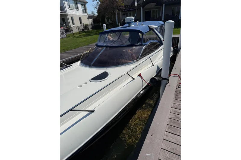 Slide: The Image of 2000 Sunseeker Superhawk 34 docked, showcasing sleek design and modern features. - 57