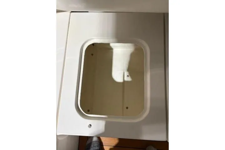 Slide: The Image of Sunseeker Superhawk 34 (2000) interior compartment detail, showcasing storage space. - 58