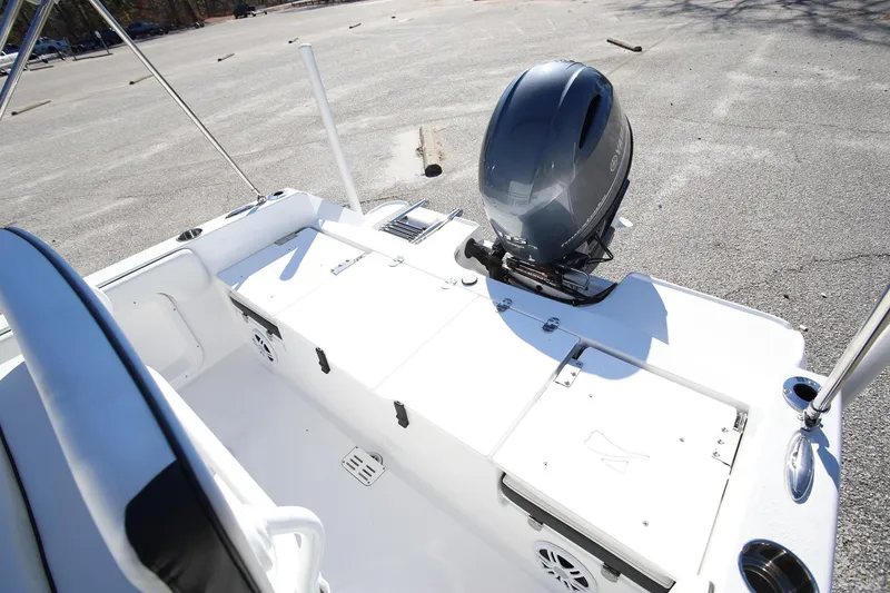 Slide: The Image of 2025 Stingray 173 CC boat with outboard motor in a parking lot. - 11