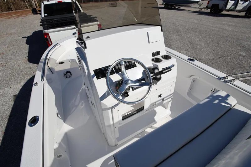 Slide: The Image of 2025 Stingray 173 CC boat interior with steering wheel and seating. - 13