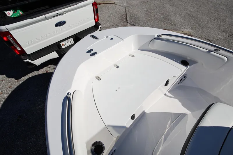Slide: The Image of 2025 Stingray 173 CC boat near a white Ford Super Duty truck. - 21