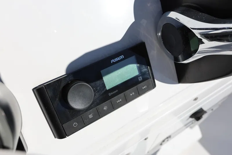 Slide: The Image of Control panel of 2025 Stingray 173 CC boat featuring Fusion audio system. - 29