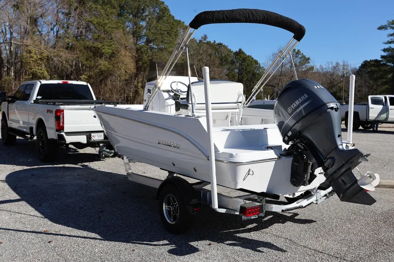Slide: The Image of 2025 Stingray 173 CC boat on trailer, attached to a white pickup truck. - 5