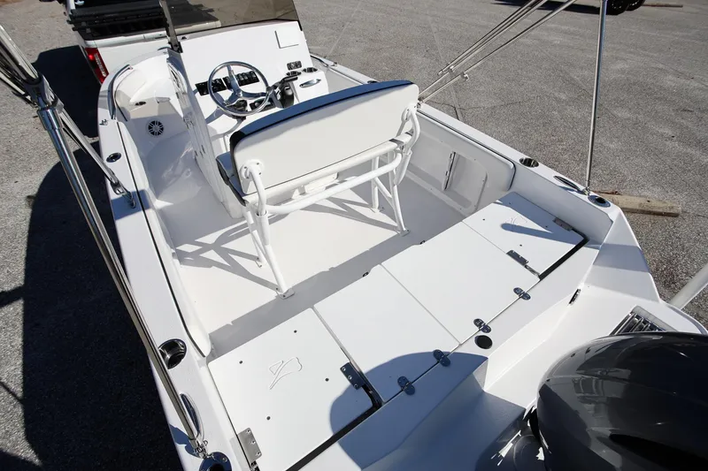 Slide: The Image of 2025 Stingray 173 CC boat interior with steering console and seating, showcasing modern design. - 6