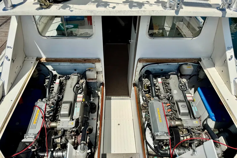 Slide: The Image of 1973 Bertram 31 Flybridge Cruiser engine compartment with dual Yanmar engines. - 2