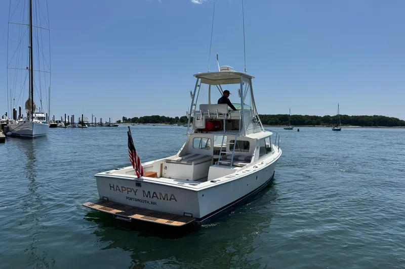 Slide: The Image of 1973 Bertram 31 Flybridge Cruiser "Happy Mama" on calm waters, Portsmouth, NH. - 23