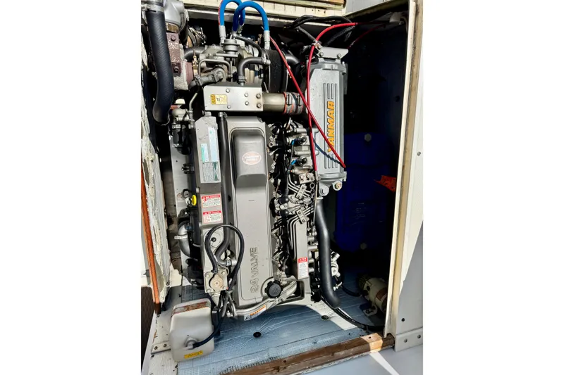 Slide: The Image of Engine compartment of a 1973 Bertram 31 Flybridge Cruiser, featuring a Yanmar engine. - 29