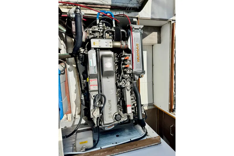 Slide: The Image of Engine of a 1973 Bertram 31 Flybridge Cruiser, featuring a Yanmar diesel engine. - 30