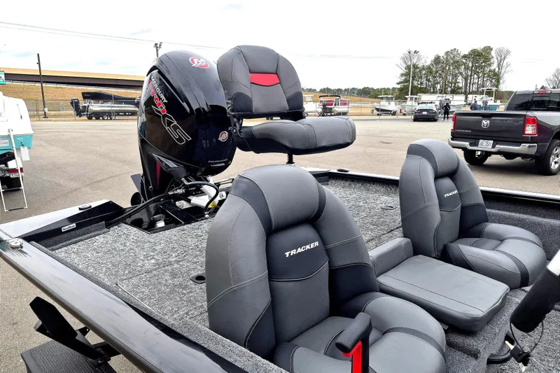Slide: The Image of 2026 Tracker Pro Team 190 boat with gray seating and powerful outboard motor. - 12