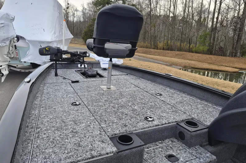 Slide: The Image of 2026 Tracker Pro Team 190 boat deck with seating and fishing equipment. - 9