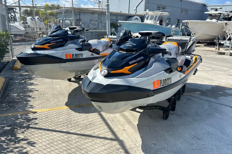 The Image of 2023 Sea-Doo FishPro Trophy 170 jet skis parked outdoors. - 1