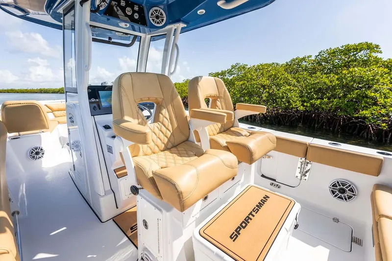 Slide: The Image of Manufacturer Provided Image: 2025 Sportsman Heritage 261 Center Console boat interior with tan seating and console. - 16