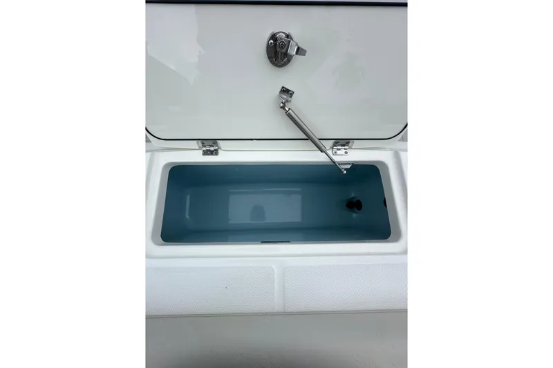 Slide: The Image of Open storage compartment on 2020 Boston Whaler 330 Outrage boat. - 24