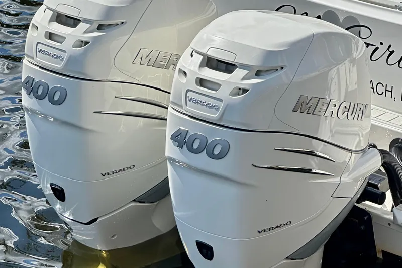 Slide: The Image of Twin Mercury Verado 400 engines on a 2020 Boston Whaler 330 Outrage boat. - 27