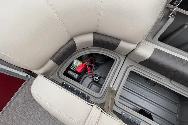 Slide: The Image of 2025 Sun Tracker Party Barge 24 DLX under-seat storage with battery compartment. - 24