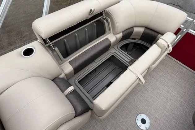 Slide: The Image of 2025 Sun Tracker Party Barge 24 DLX seating with open storage compartments. - 27