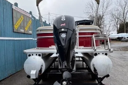 Slide: The Image of 2025 Sun Tracker Party Barge 24 DLX pontoon boat with powerful outboard motor. - 4