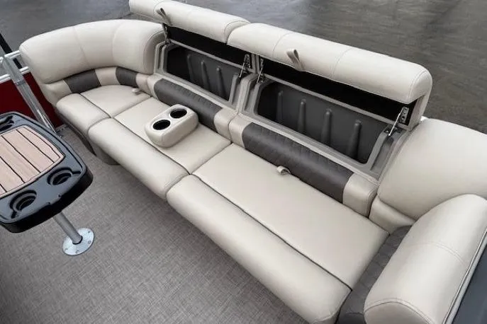 Slide: The Image of Luxurious seating on 2025 Sun Tracker Party Barge 24 DLX with storage and cup holders. - 8